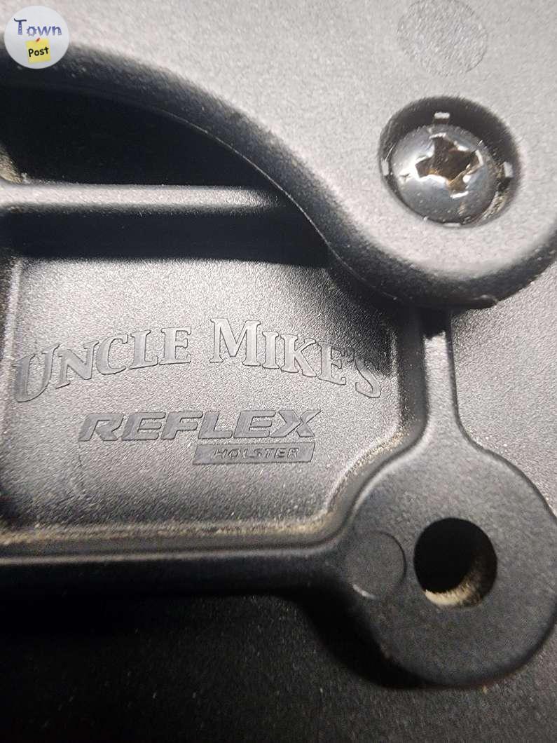 Photo of Uncle mikes belt loop quick draw holster